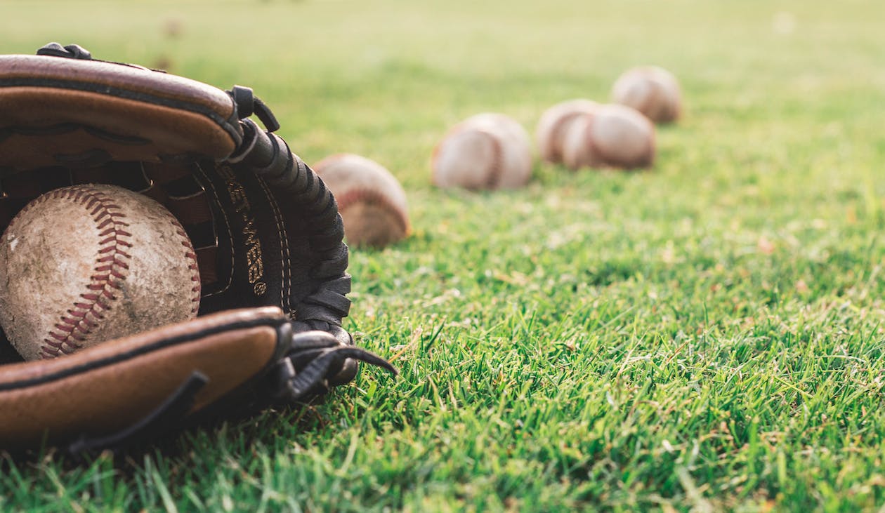 Free White Baseball Ball On Brown Leather Baseball Mitt Stock Photo