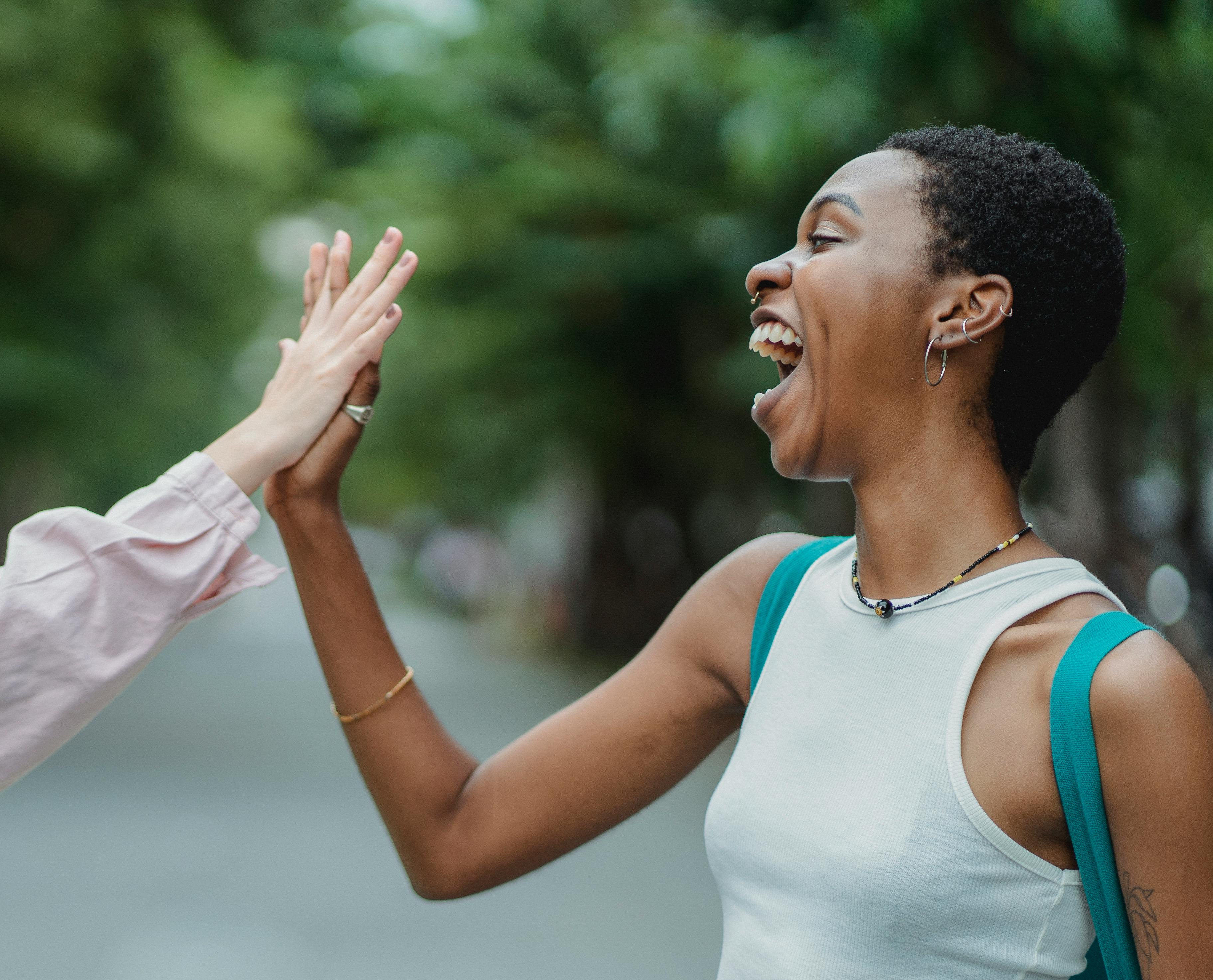 Free Happy Woman Doing A High Five Stock Photo