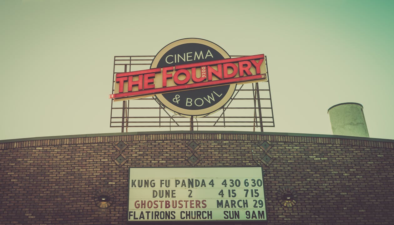 Free Signs on Building of Cinema with Bowling Stock Photo